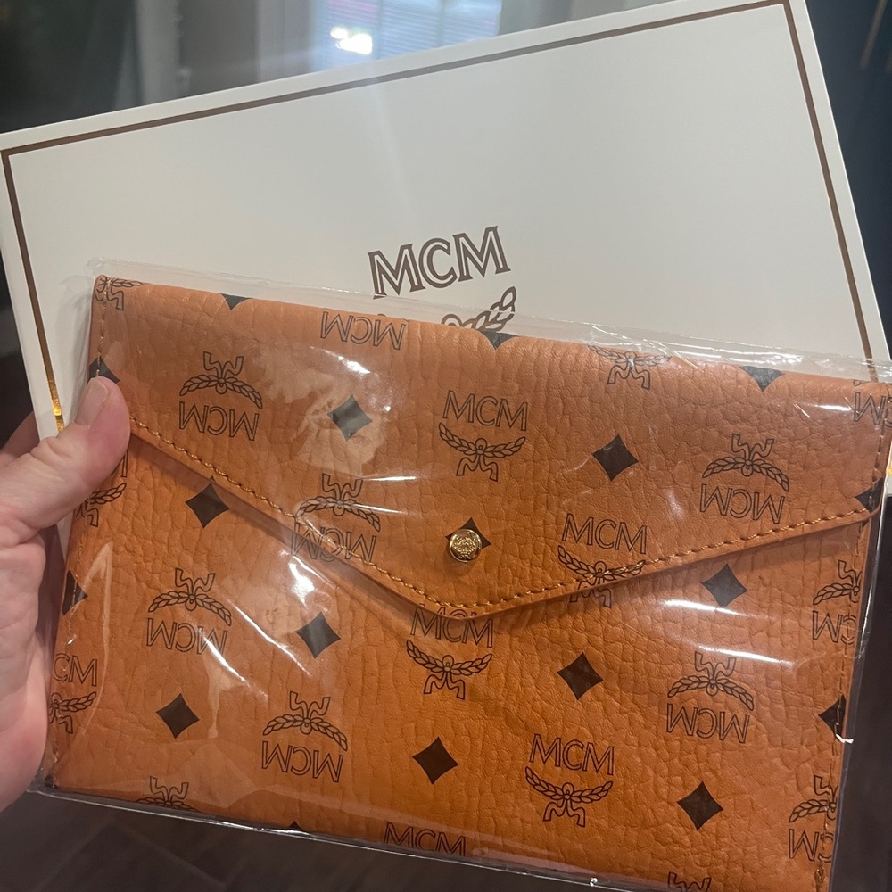 MCM Orange Monogram Clutch